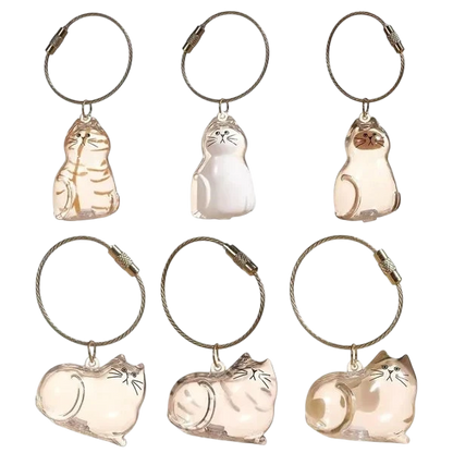 Furvana cat hair keepsake keychains in various clear twisted egg shapes with metal rings for keys or bags
