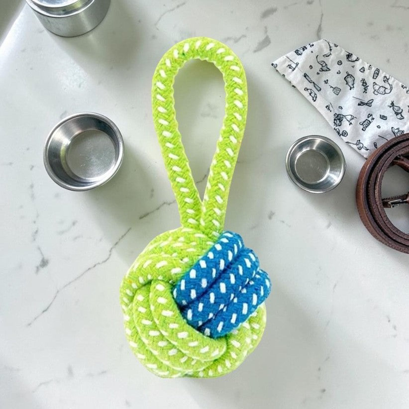 Furvana durable cotton rope dog chew toy in bright lime green and blue, featuring a knotted ball design.