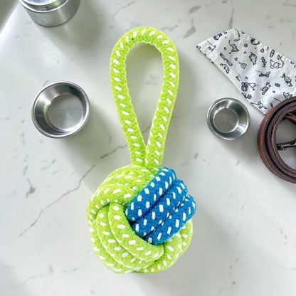 Furvana durable cotton rope dog chew toy in bright lime green and blue, featuring a knotted ball design.