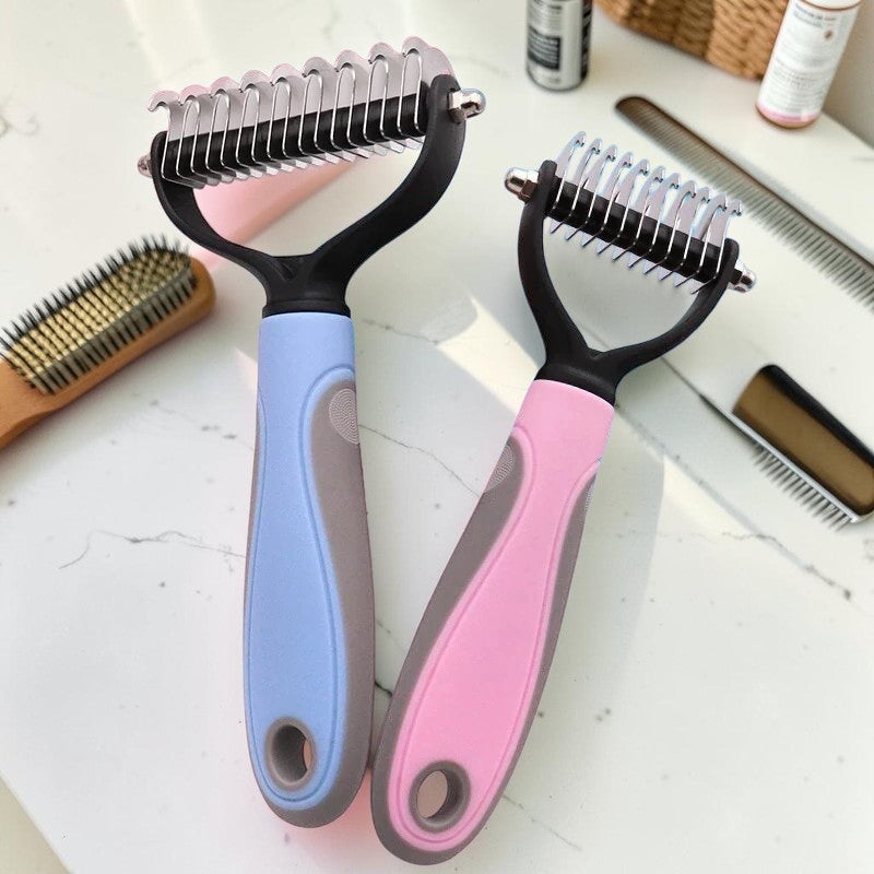 Furvana dual-sided pet grooming combs with blue and pink ergonomic handles for removing mats and loose fur.