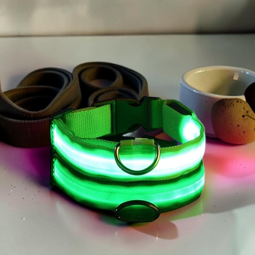 Furvana green LED safety dog collar with reflective nylon strap and quick-release buckle on a marble surface