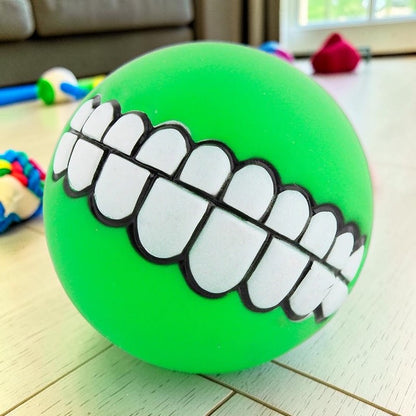 Furvana green squeaky rubber ball toy with a funny human-like toothy grin for interactive dog play