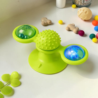 Furvana green windmill cat toy with suction base, spinning interactive compartments, and textured dental massage center