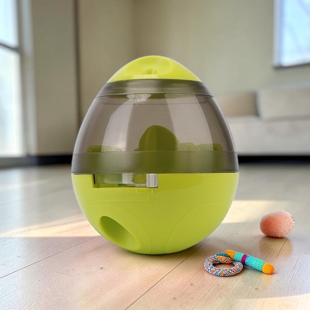 Furvana interactive pet treat ball in lime green and translucent grey, designed for slow feeding and playtime.