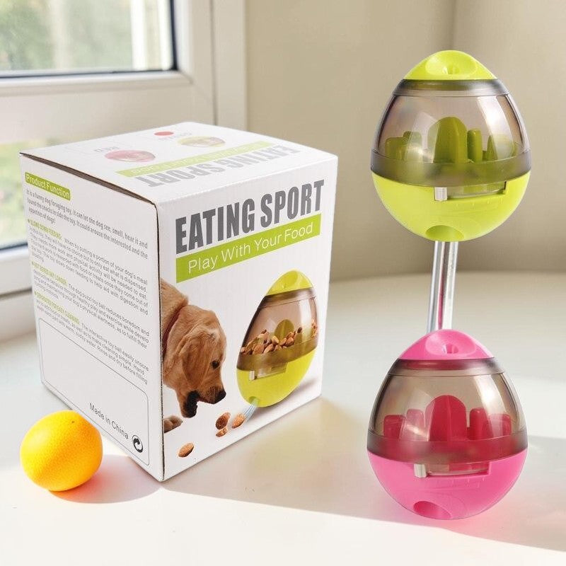 Furvana interactive treat dispenser balls in lime green and pink with a product box on a white surface