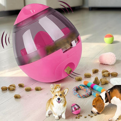 Furvana interactive pink treat ball toy dispensing dry food for a dog and cat on a wooden floor