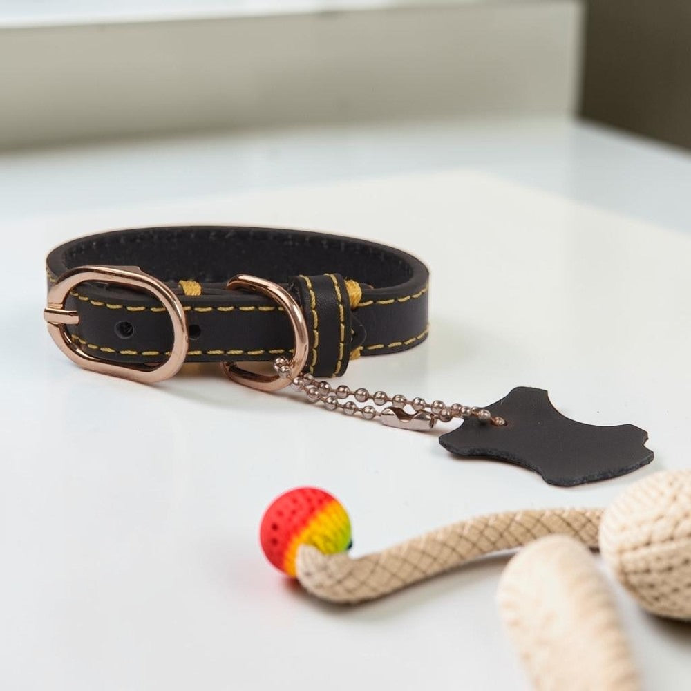 Furvana dark brown genuine leather dog collar with rose gold buckle, double D-rings, and a leather hangtag.