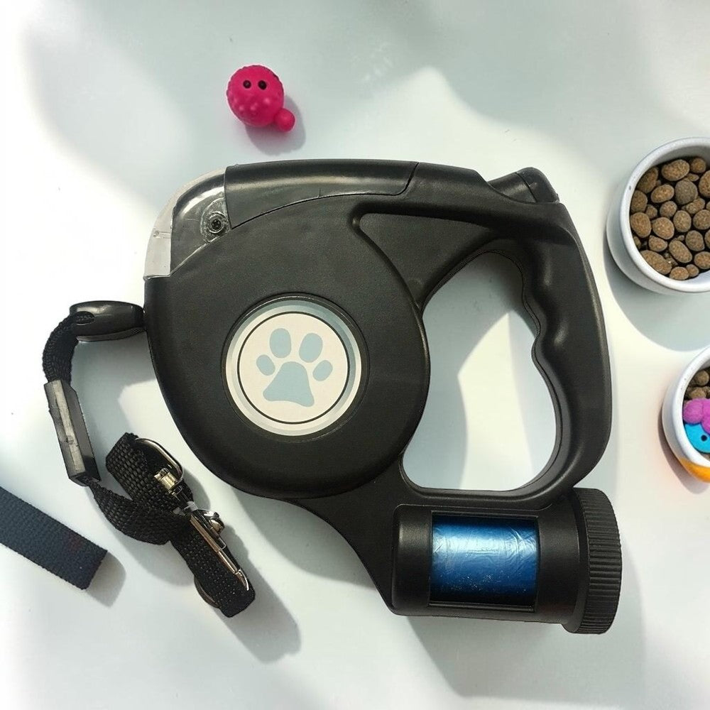 Furvana black retractable dog leash with built-in LED light, ergonomic handle, and paw print design on white surface.