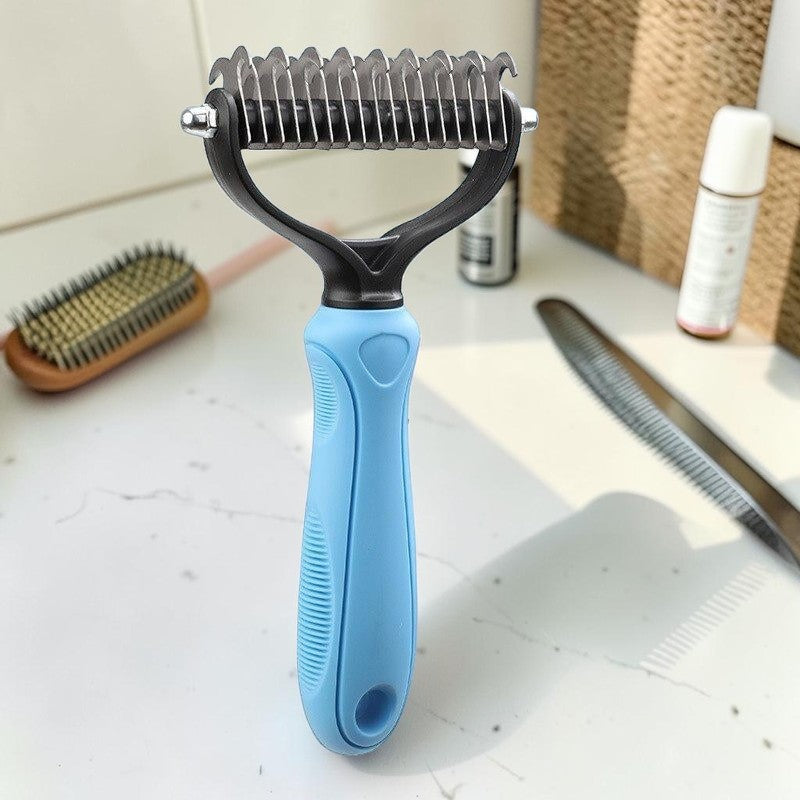 Furvana pet fur knot remover comb with stainless steel dual-sided blades and a light blue ergonomic handle.