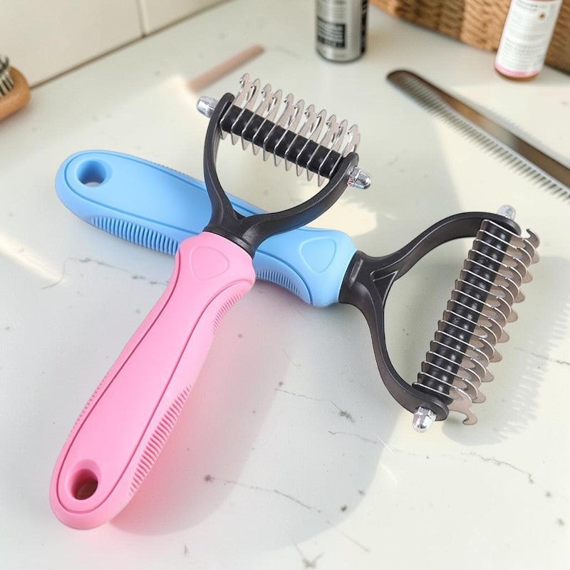 Furvana dual-sided pet grooming combs with stainless steel teeth and pink and blue ergonomic non-slip handles