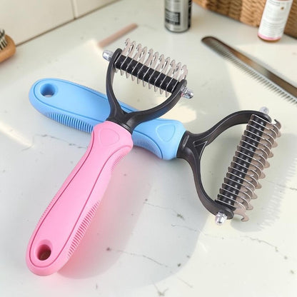 Furvana dual-sided pet grooming combs with stainless steel teeth and pink and blue ergonomic non-slip handles