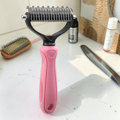 Furvana pet fur knot remover comb with dual-sided stainless steel teeth and a pink ergonomic non-slip handle.