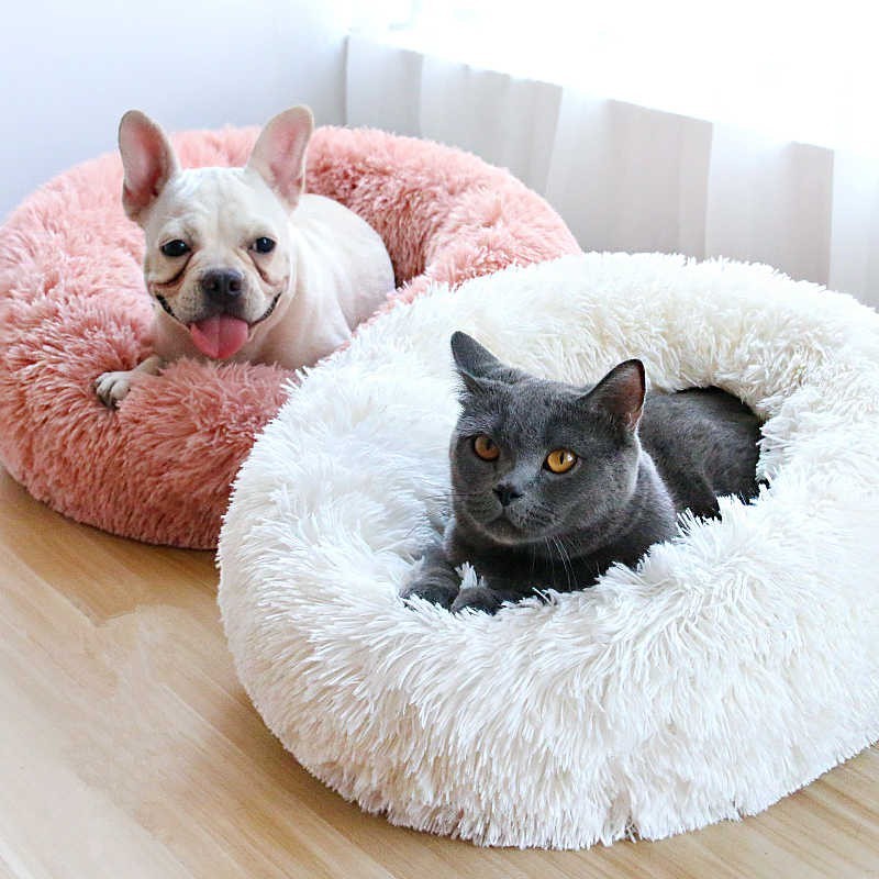 Furvana calming donut beds for pets with a French Bulldog in pink and a grey cat in white plush faux fur