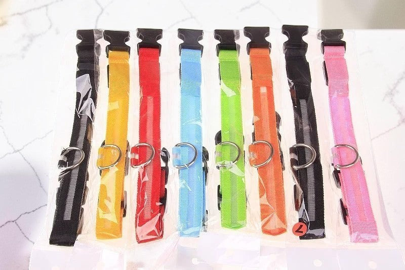 Furvana rechargeable LED safety dog collars in various bright colors with durable nylon and quick-release buckles.