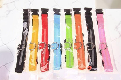 Furvana rechargeable LED safety dog collars in various bright colors with durable nylon and quick-release buckles.