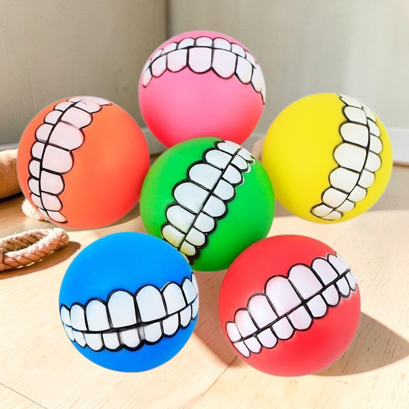 Furvana squeaky rubber pet balls in assorted bright colors with funny human-like teeth designs for interactive play