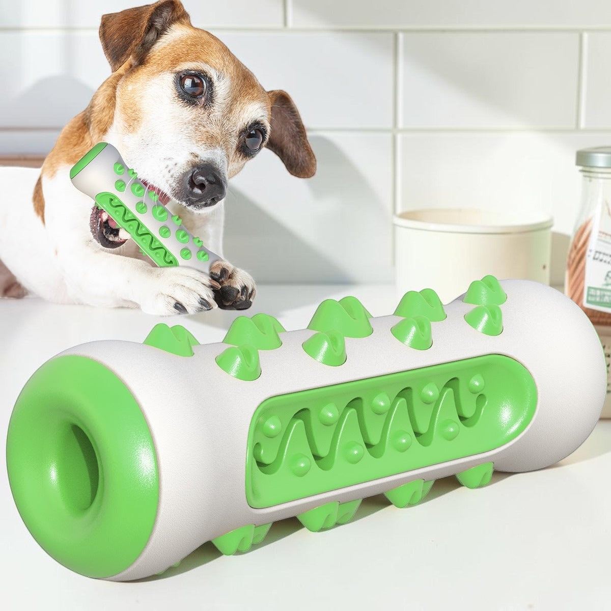 Furvana white and green textured TPR dental chew toy for dogs being enjoyed by a Jack Russell Terrier