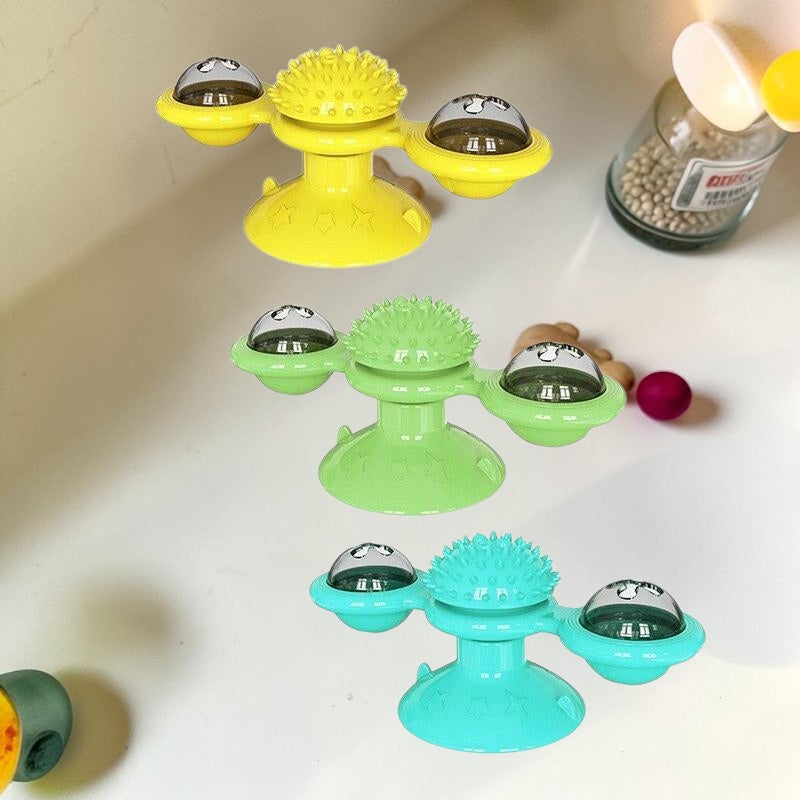 Furvana windmill cat toys in yellow, green, and blue with suction bases, spinning compartments, and dental textures.