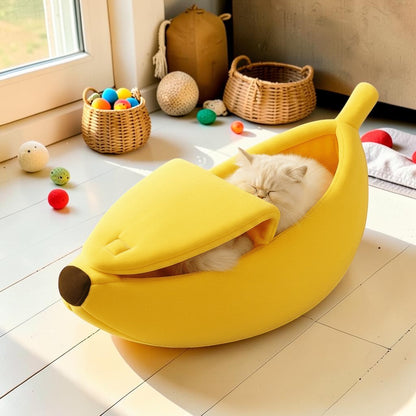 Furvana banana-shaped yellow plush pet bed with a cat sleeping inside, featuring a peelable velcro top design.