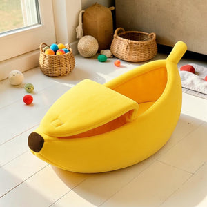 Furvana yellow banana-shaped pet bed with a peelable velcro top, made from soft plush fabric for cats and small dogs.